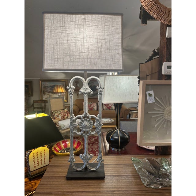 Large sensational pair of table lamps cleverly created with a pair of found object iron architectural fragments on black...
