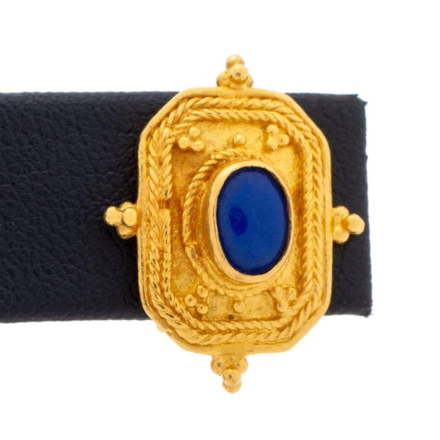Pair of Etruscan Revival Style 22K Yellow Gold Lapis Lazuli Bezel Set Granulation Earrings, worn on ear with omega clip...