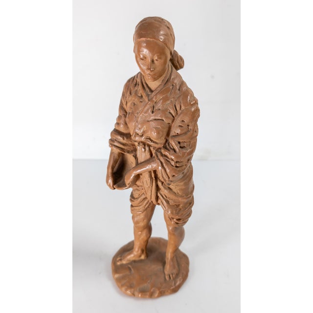 We are selling this cool well modeled figure of an Asian woman with a wash bowl. The figure appears to be redware or terra...