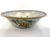A substantial and finely executed porcelain bowl featuring a hand-painted armorial crest marked “Engelandt,” richly...