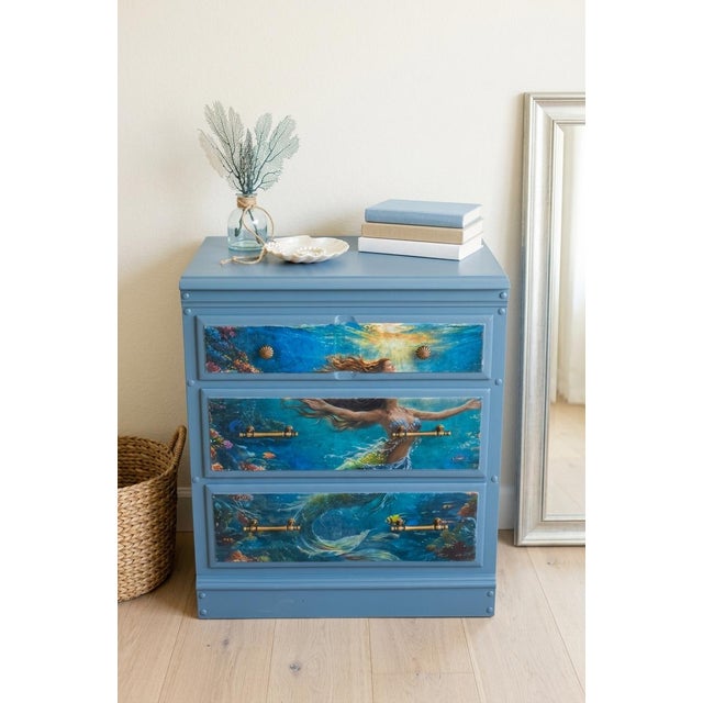Transform your space with this stunning, one-of-a-kind ocean-themed dresser! Finished in a rich steel-blue chalk paint,...
