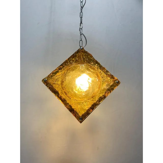 Fantastic and particular ceiling light attributed to the mazzega company. it is a chandelier with double orange plate....