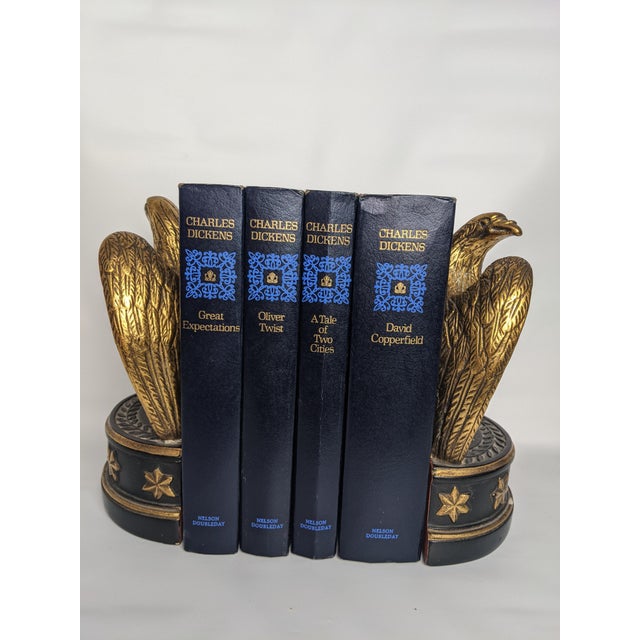 A beautifully coordinated collection of four literary classics by Charles Dickens, presented in handsome mid-century...