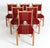 A set of 6 classic Danish modern dining chairs upholstered in a cheeky red striped fabric offset by densely grained carved...