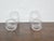 This handsome pair of tall hurricane glass shades dates to circa 1900 and was made in England. Handblown in clear glass,...