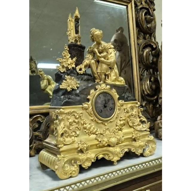19th Century Clock in Gilt and Bronze, in Good conditions. Designed before 1890