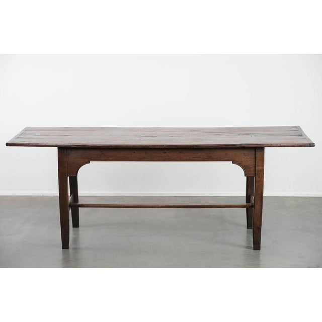 Unique antique, country-style English oak dining table from the early 18th century, seating 4 to 6 people, features...