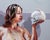 Unexpected Links by Ale Casanova | Oil on linen Woman holding a skull with a mouse on top. For Sale