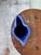 An artisanal cobalt blue ceramic pitcher in the form of a toucan, with generous spout and looped handle. The deep...