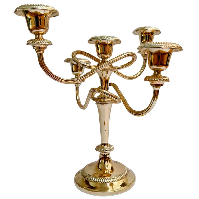 Bought in Paris, this regal pair of silverplated candelabras dates to the early 20th Century (circa 1920–1935). Featuring...