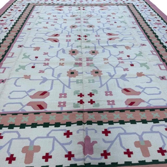 This handmade Indian dhurrie (flatweave kilim-style) rug is a celebration of simplicity, craftsmanship, and soft, refined...