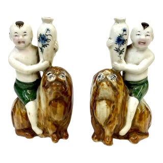 19th Century Porcelain Vases of Babies on Lions - a Pair For Sale