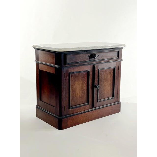 Beautiful antique marble top wash stand cabinet. I would use it as a nightstand, mini bar or maybe entry table. Overall...
