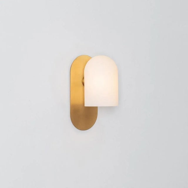 Brass small sconce by schwung. Dimensions: w 10.5 x d 14 x h 23 cm. Materials: brass, frosted glass. Finishes available:...