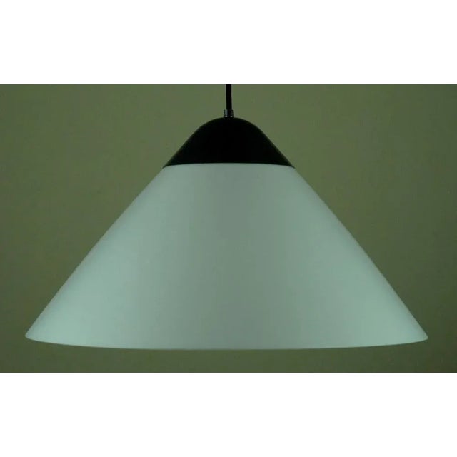 Opala Midi model pendant lamp was designed by Hans J. Wegner in 1973, and manufactured by Louis Poulsen, Denmark. The lamp...