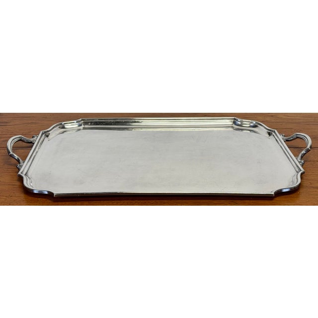 Vintage oversized silverplate serving tray with decorated edge and handles. Elgin Unity manufactured. Age wear. Some signs...