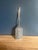 A cake and pastry server. The entire blade face is engraved with symmetrical foliate scrollwork framed by a fine linear...