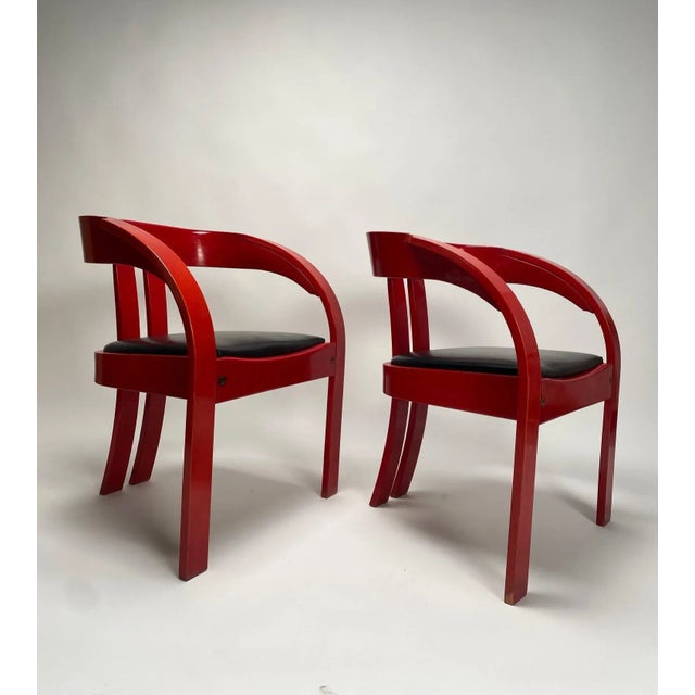 Set of six armchairs by Giovanni Battista Bassi, lacquered wood, leather Italy 1960s. A cheerful curvy red lacquered...