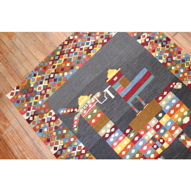 Accent size Persian Kilim from the late 20th century with a Small bird riding on a colorful pony surrounded by an exotic...