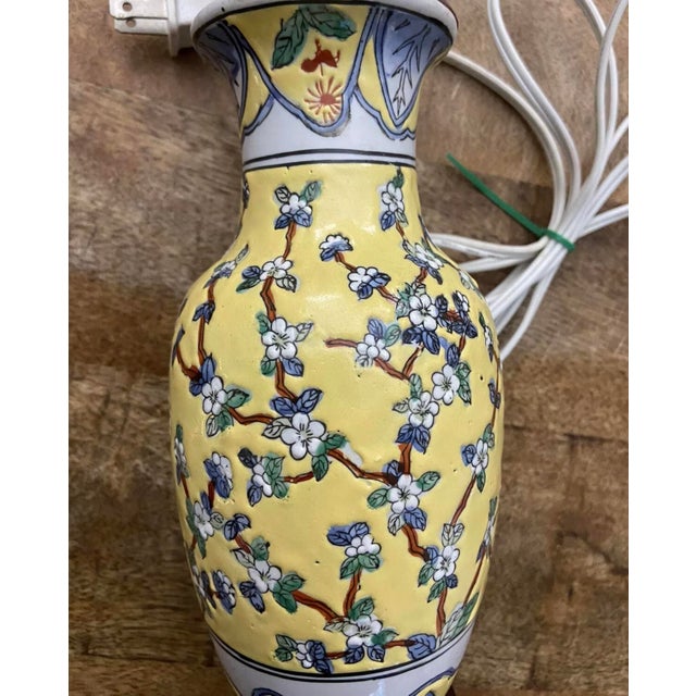 Lovely vintage Chinese export petite lamp with heavily-enameled floral design in a famille rose style. Excellent...
