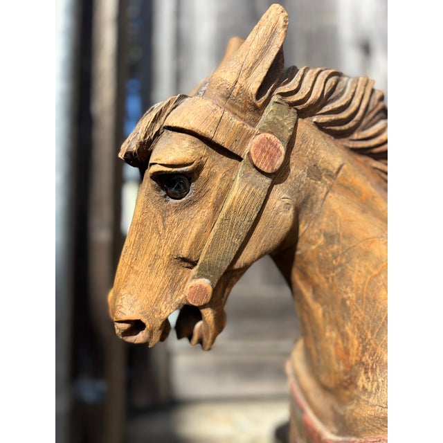 This hand-carved carousel horse sculpture is a beautiful and unique collectible piece. Made of wood in the United States,...