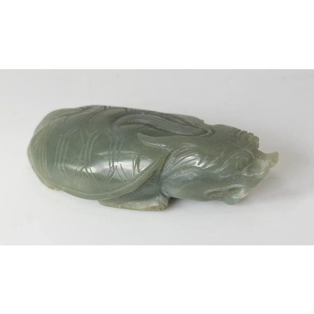 We are selling this 20th century Chinese celadon green carving of a turtle. The figure is carved from a Jade like looking...