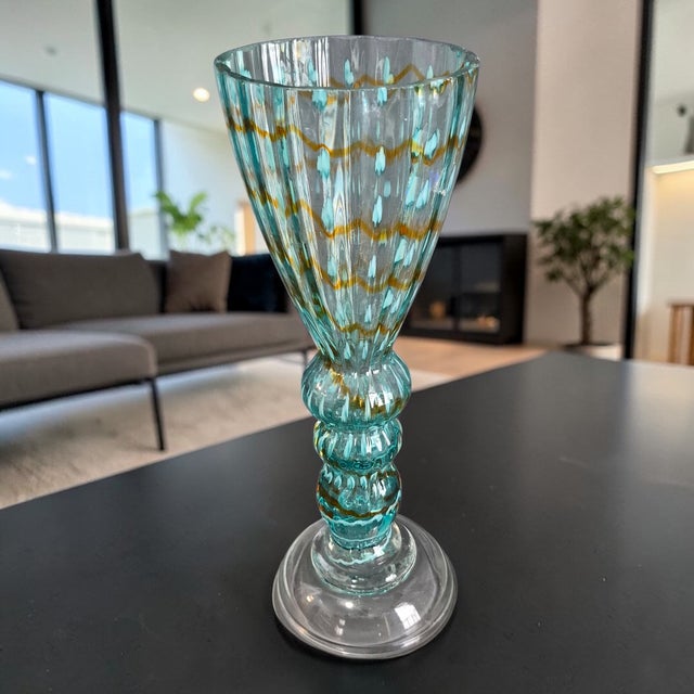 This Vintage Mid-Century Modern Italian Art Glass Aqua Blue Pedestal Vase is a stunning piece of decorative pottery and...