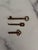 A lot of three antique keys of various designs and sizes. Fun for creating a rustic or Victorian vibe.