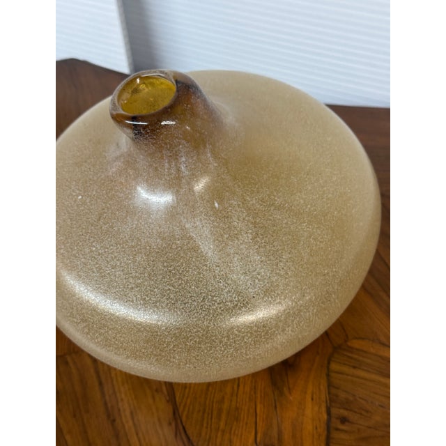 Design Plus Gallery presents an Amber Art Glass. This squat vase showcases a rounded form with a mottled Scavo-style...
