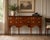 A refined early 20th century Federal Revival sideboard, showcasing beautifully figured flame mahogany veneers and elegant...