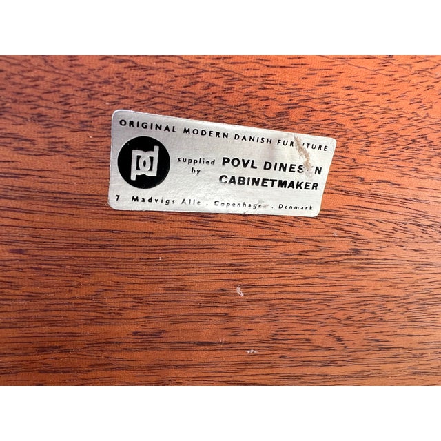 An incredibly scarce and highly collectible Ib Kofod‑Larsen 8‑drawer dresser, produced by Povl Dinesen as part of the...