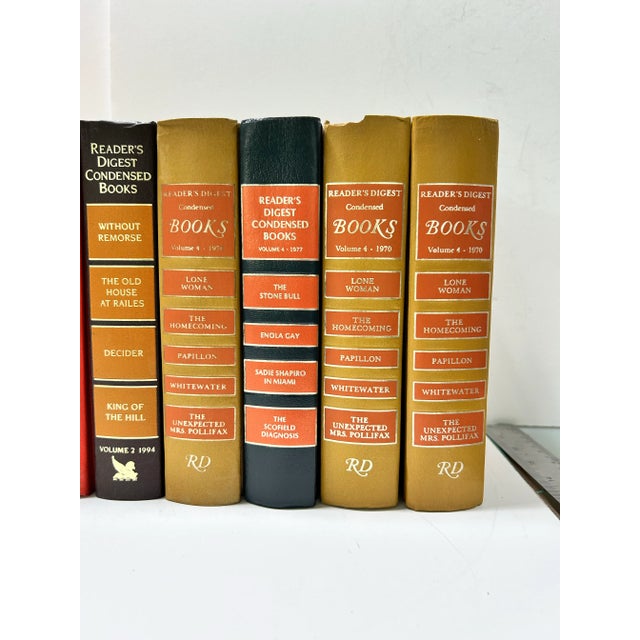 This set of 14 vintage orange decorative books is ideal for color-blocked shelf styling, library staging, and warm layered...