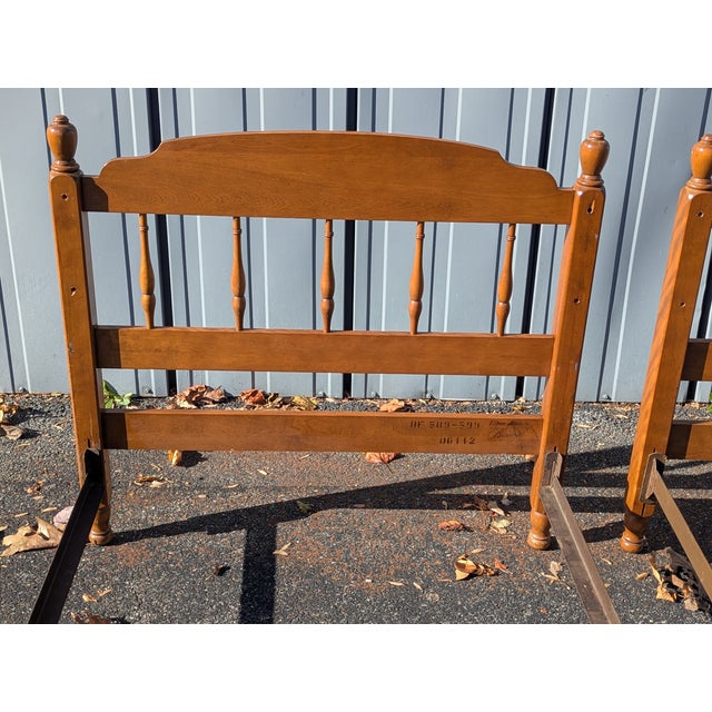 A rock solid pair of 1960s solid Maple twin size bed frames from The Ethan Allen Baumritter collection. Made out of solid...