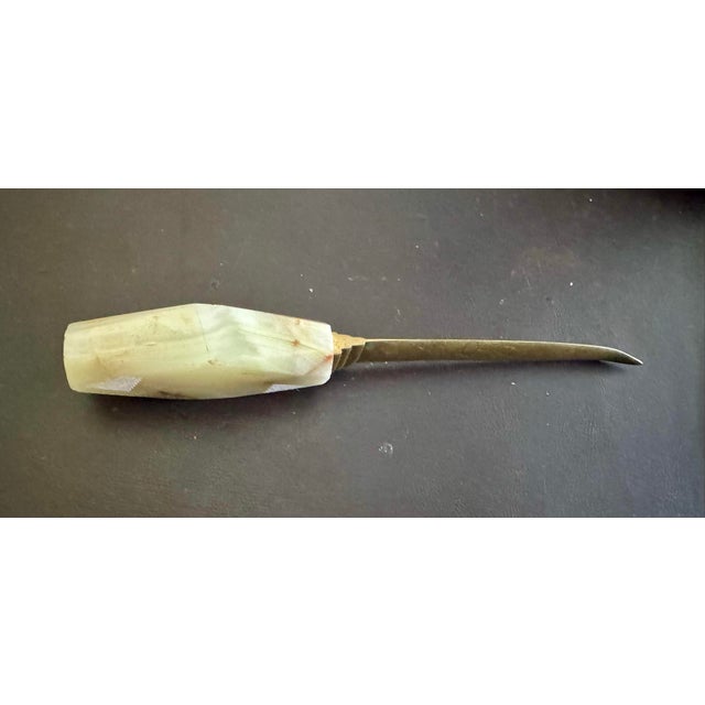 Elevate your workspace with this elegant mid-century modern letter opener. It features a beautifully sculpted, diamond-...