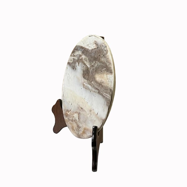 This is a round shape natural stone display with a natural abstract pattern. It is a nice unique accent piece for home...