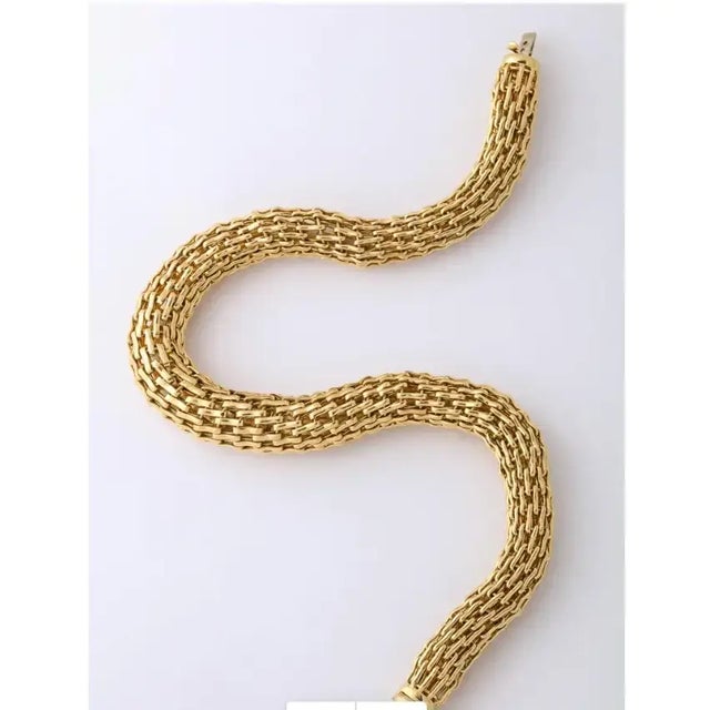 Solid Gold 18kt Choker. Significant weight and style in one. Made of assembled Links with a woven look to the rope. 17"...