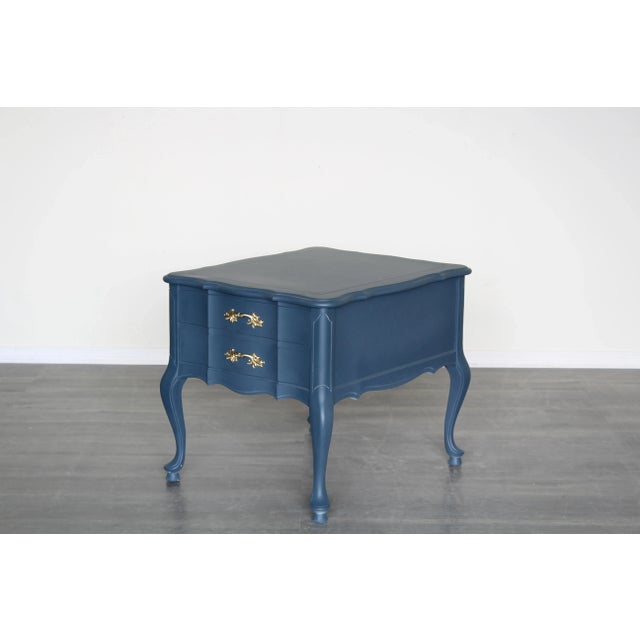 Vintage French provincial blue nightstand. This nightstand is professionally refinished in blue with gold painted...
