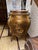 A Louis XV style bombe cabinet painted in the Vernis Martin manner. The swelling single door is painted with a charming...