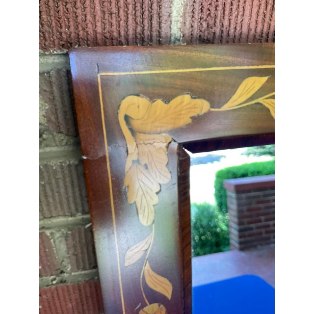 19th Century Dutch Marquetry Wall Mirror in good estate condition. There are some veneer chips, a repair and wear to the...