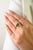 This elegant solitaire ring features 1 natural emerald cut emerald totaling 0.89 carats, set in 14k yellow gold. The...