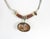 Late 20th century artist studio made necklace. Agate cabochon pendant, bauxite beads and handmade sterling silver links....