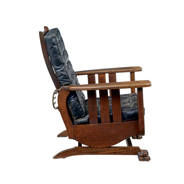 Early 20th century oak and leather rocking chair circa 1910. We are pleased to offer this unusual rocking chair made in...
