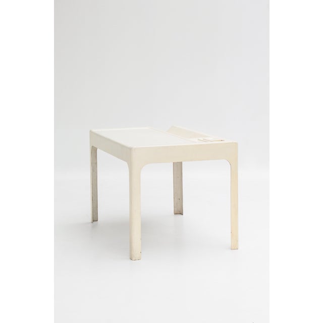 An Ozoo desk designed by Marc Berthier and produced by Roche Bobois. One-piece structure in white lacquered fiberglass...