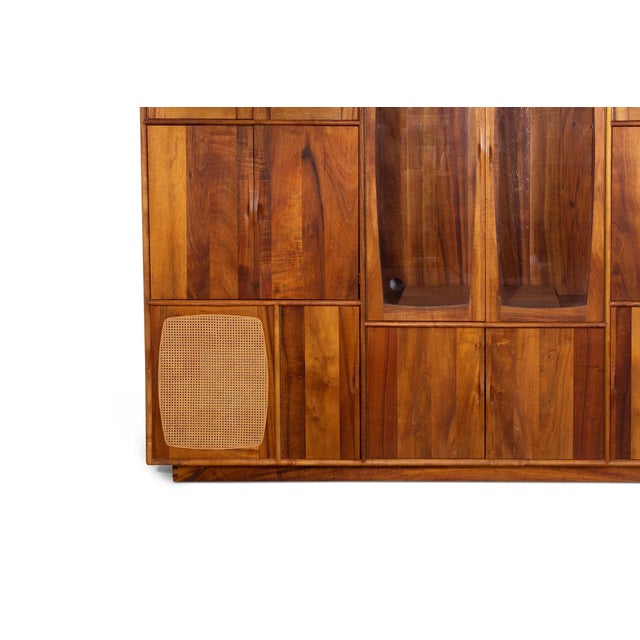 Studio crafted solid walnut, glass and wicker free standing wall unit circa early 1980’s. Has spots for record players,...