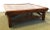 A beautiful antique kang table in the traditional Ming Dynasty style. It is made of solid wood with a mitered top, and...
