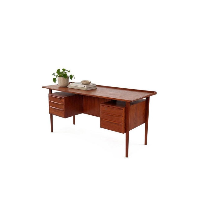 This vintage Danish desk by Peter Løvig Nielsen embodies everything that makes 1960s Scandinavian design so beloved:...
