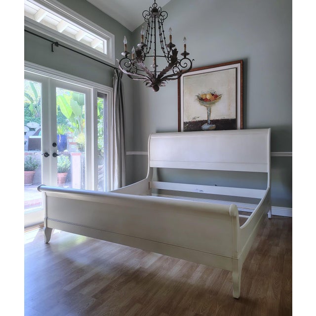 This fresh take on the traditional sleigh bed is made by Ethan Allen. It features a scaled-down footboard that gives your...