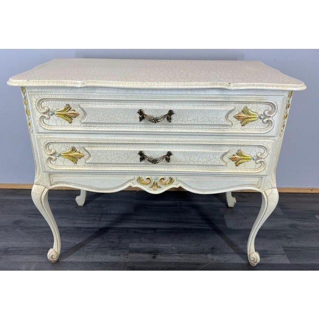 The chest of drawers \.sideboard has two drawers , the drawers are decorated with wonderful carvings, it rests on...