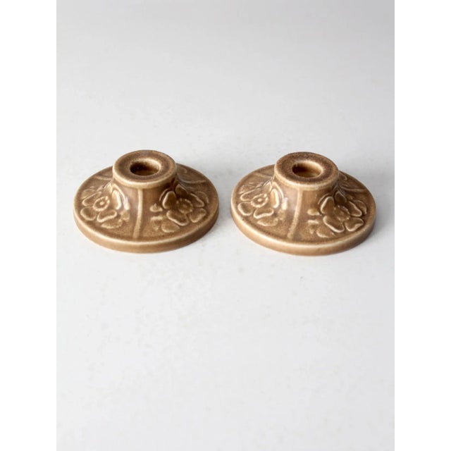 A pair of antique Rookwood Pottery candlestick holders, dated 1921. Crafted by the renowned American art pottery company,...