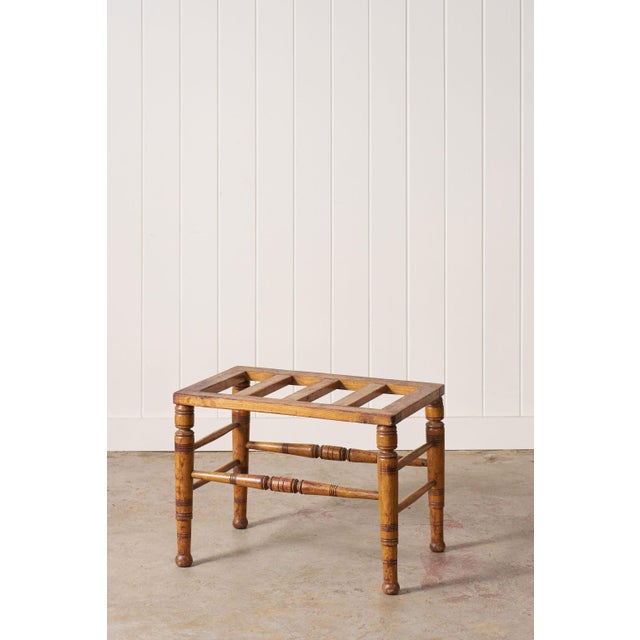 19th-century Victorian oak luggage rack with a slatted top, turned legs, and lower shelf.